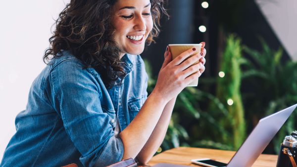 woman smiling at laptop