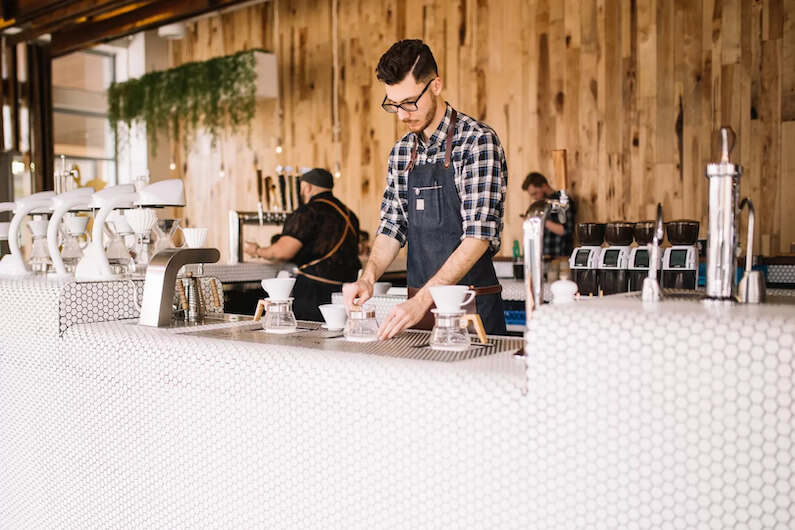 Barista working in café