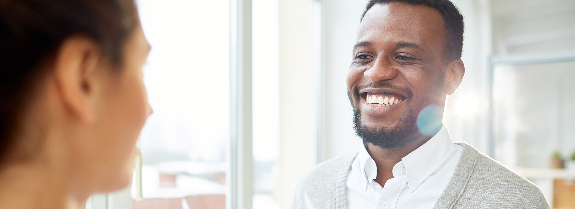 man smiling at a woman