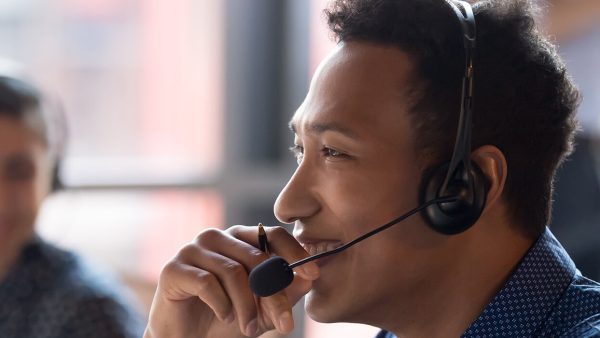 man with headset smiling