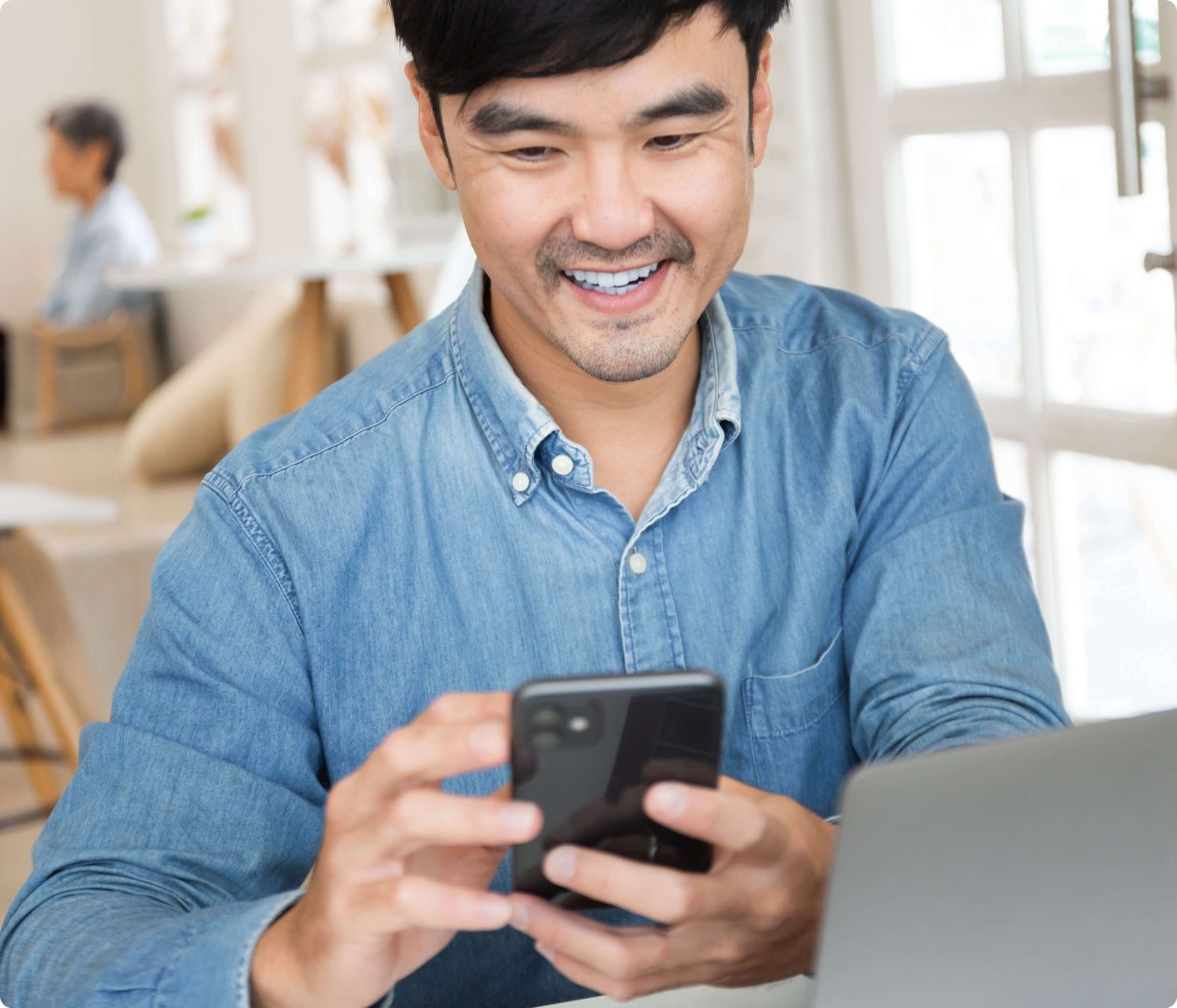 man using mobile phone screen