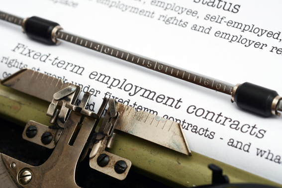 fixed term employment contracts on typewriter