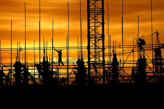 construction worker working against sunset