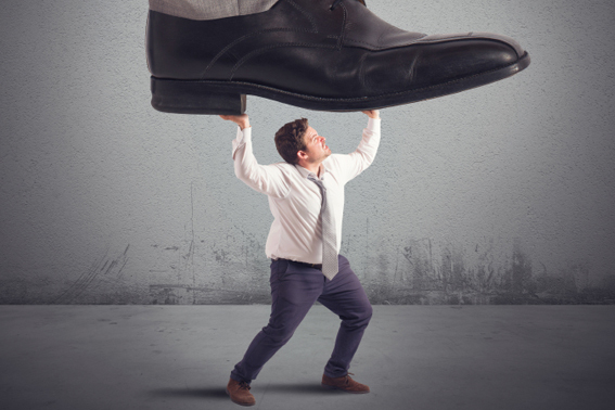 man holding giant foot above his head