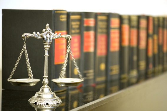 scales in front of old hardback books