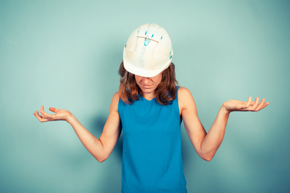 woman in hardhat confused