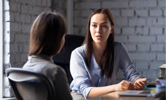 woman talking to another woman