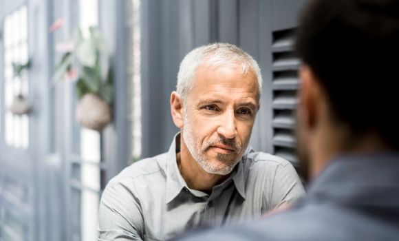 two men looking at each other