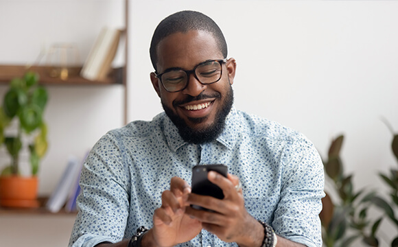 man using Moorepay's next generation app on phone