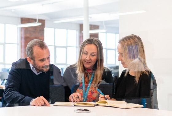 moorepay staff members in meeting