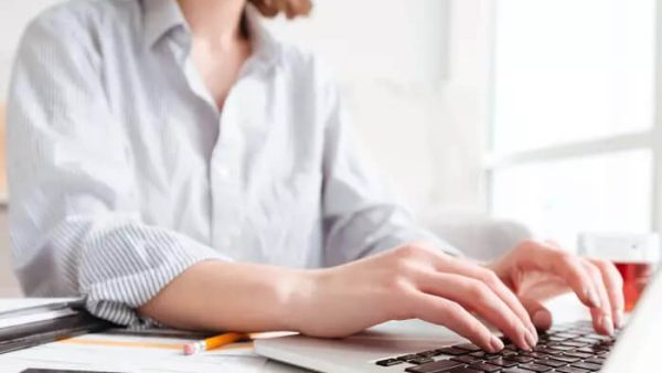 woman typing on laptop