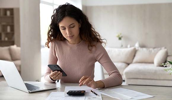 woman working things out on a calculator