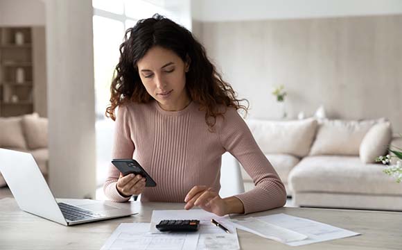 woman working things out on a calculator