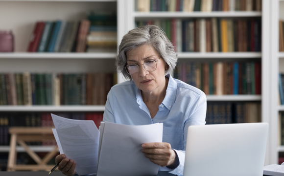 woman reading papers on dismissal