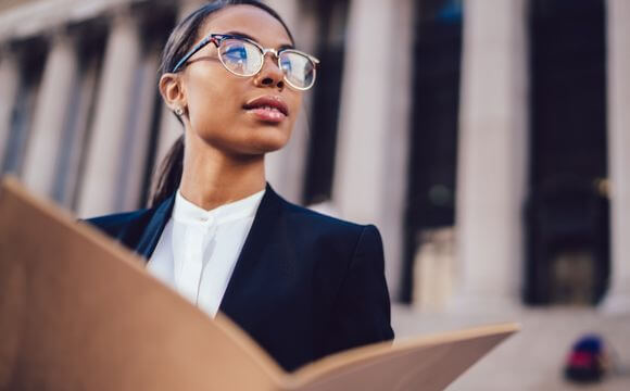 woman with file open looking to the right