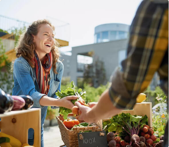 woman receiving vegetables