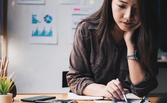 woman thinking while working