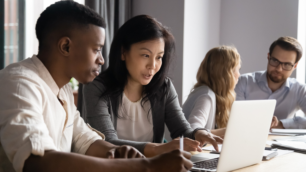 people working together on a laptop