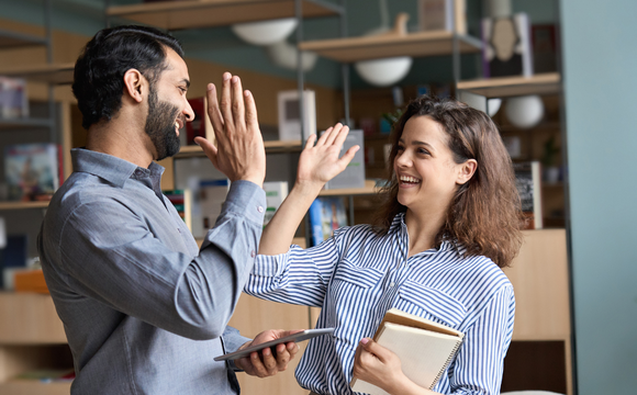 two people high fiving