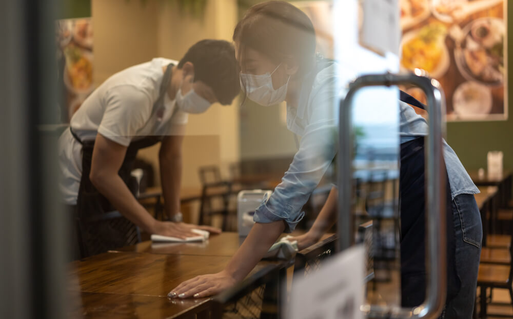 bar staff cleaning tables