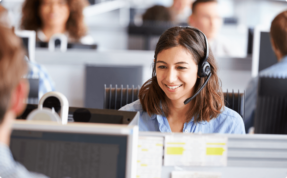 woman with a headset on smiling
