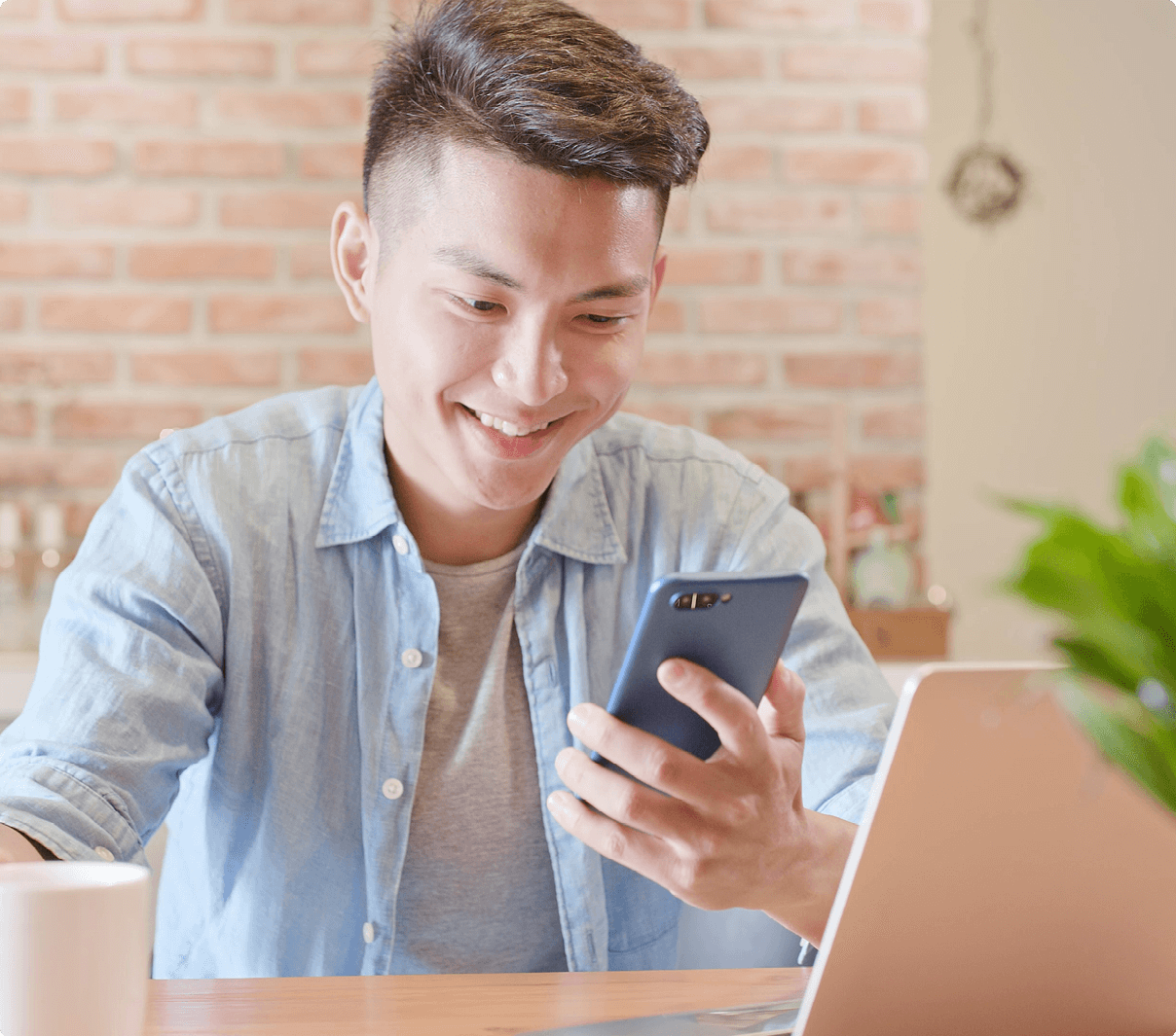 man smiling at phone