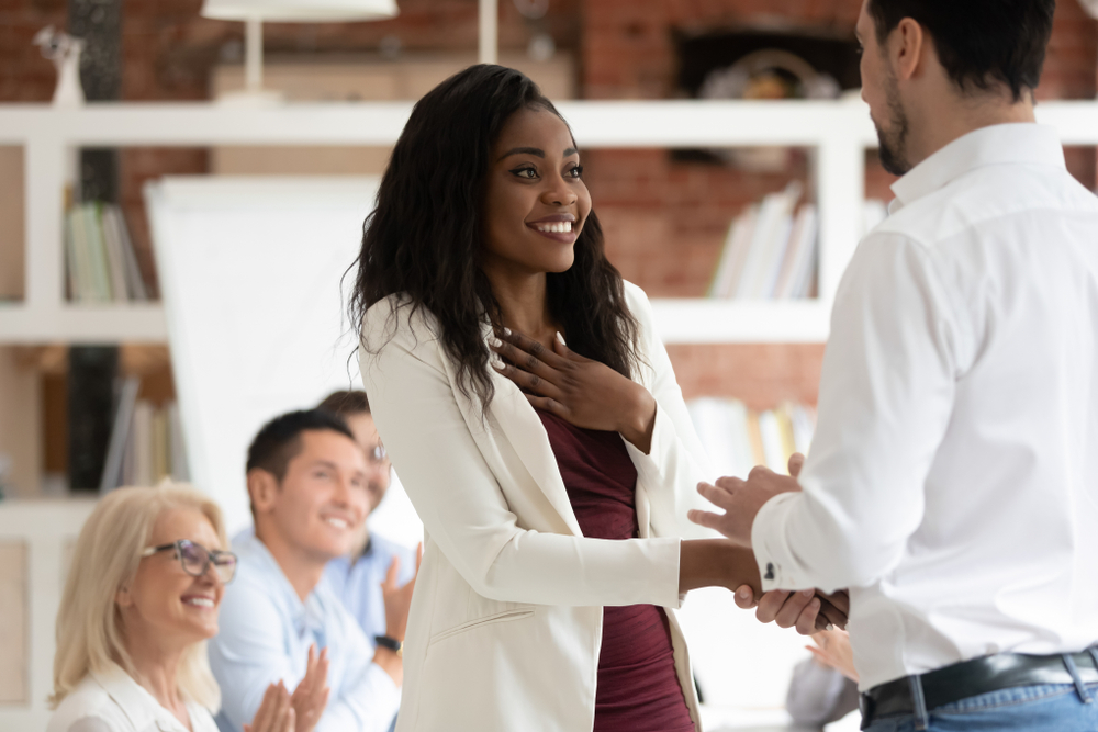 woman being praised by her employer