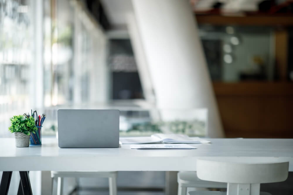 empty desk with laptop