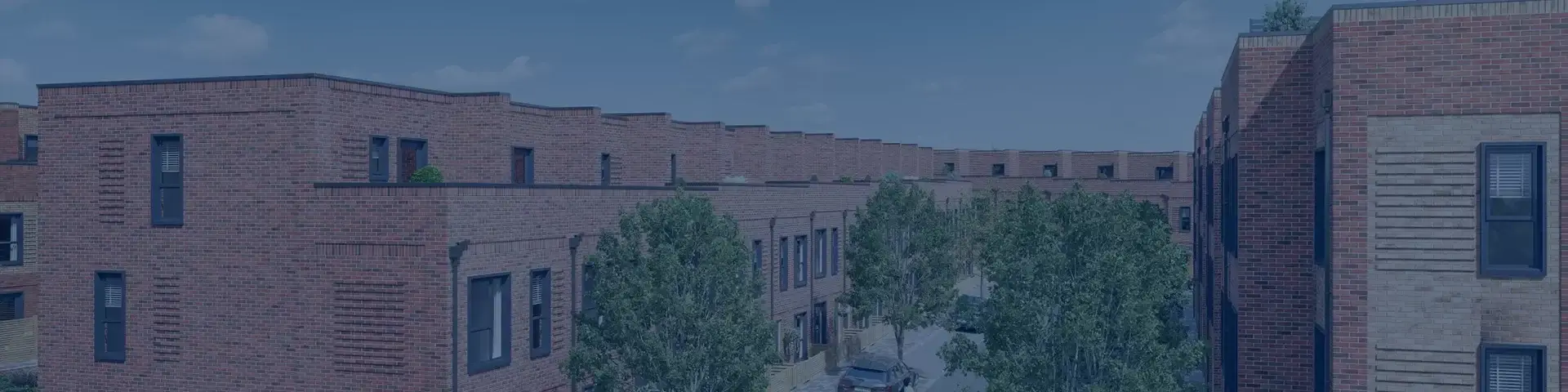 red brick buildings with cars banner