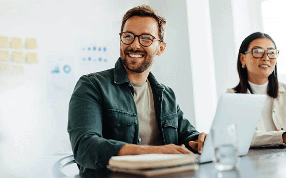 man smiling to his right