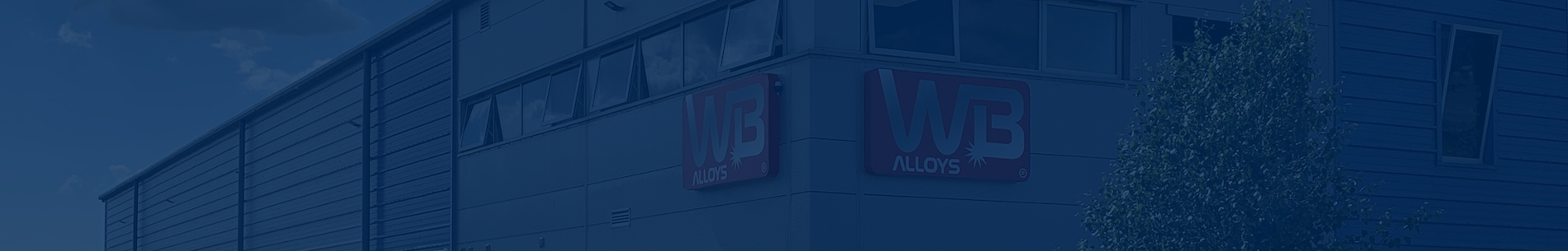 WB alloys building in blue banner