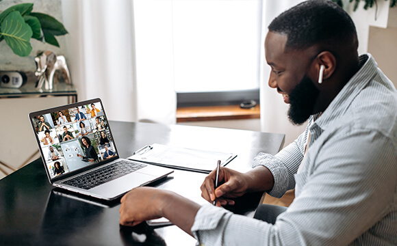 employees on video call aligning their talent strategy to business goals