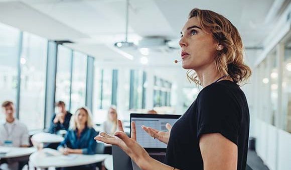 Woman presenting workshop on LGBTQ+ mental health